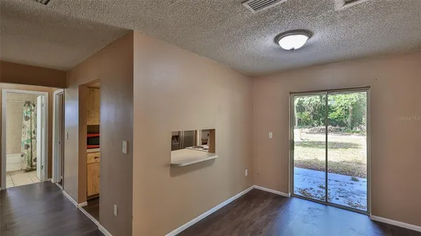 a view of a livingroom with wooden floor