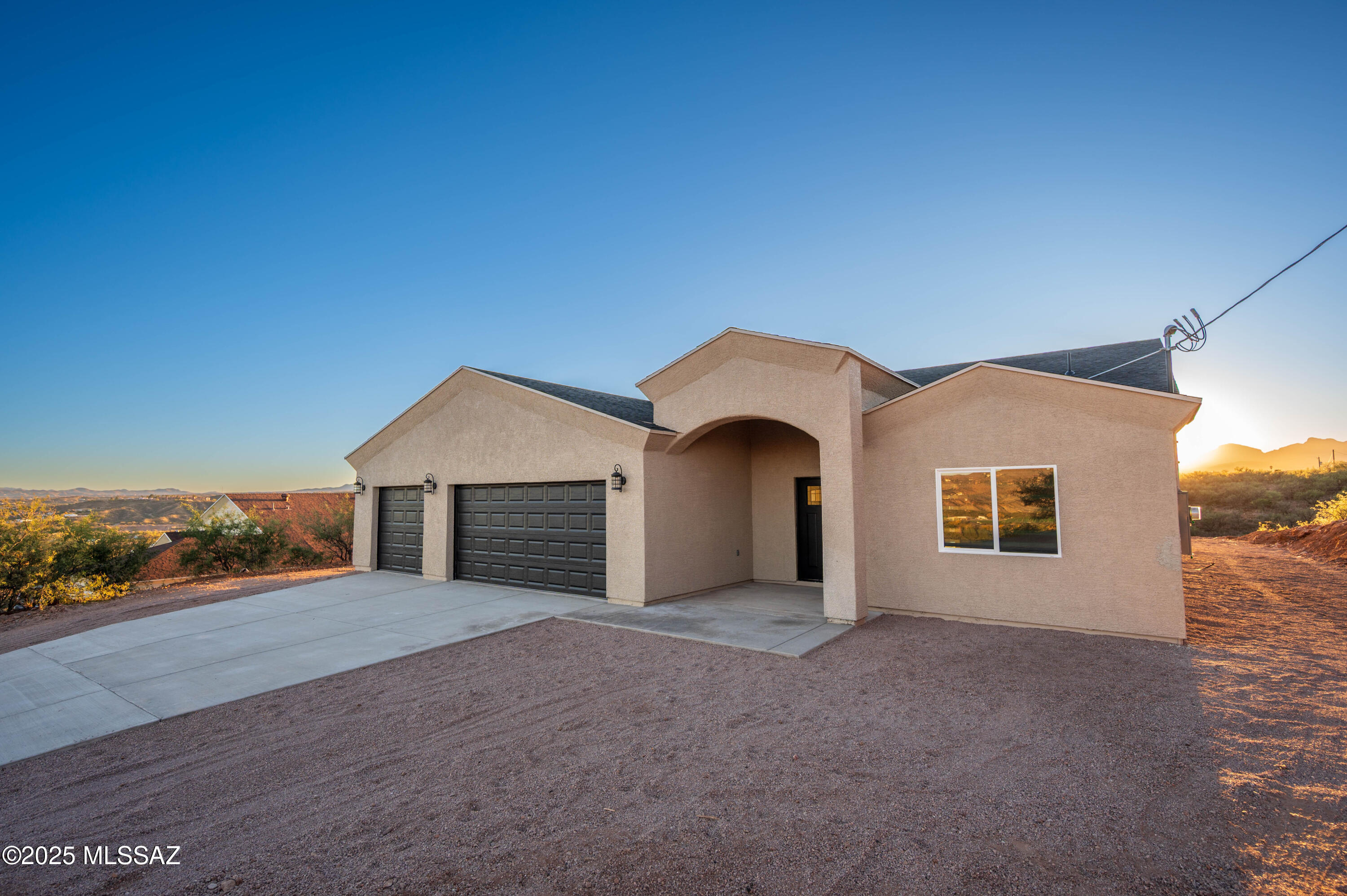 497 Calle Cipres Rio Rico, AZ 85648 - Photo 8 of 50 a view of a house with a yard and garage