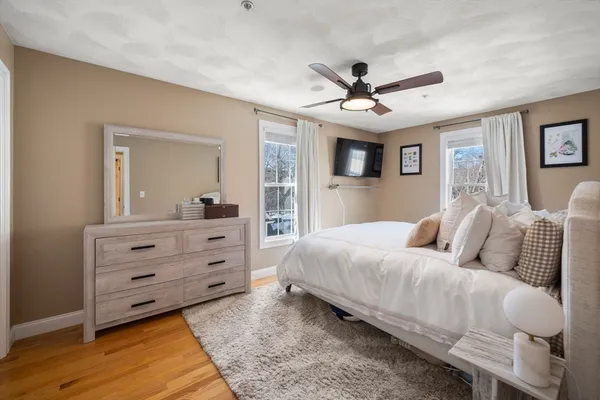 a bedroom with a bed and a dresser