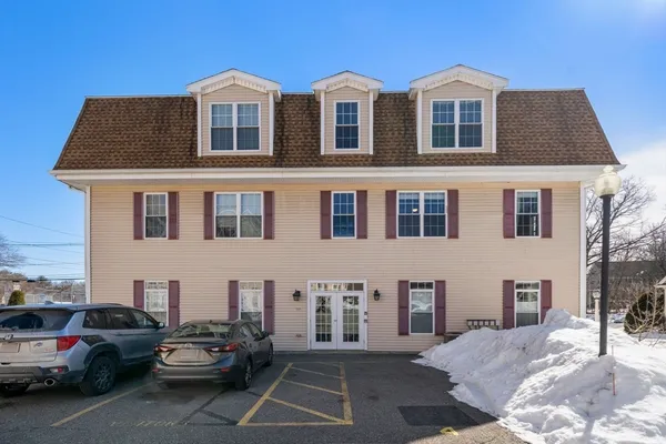 a view of a car park in front of house
