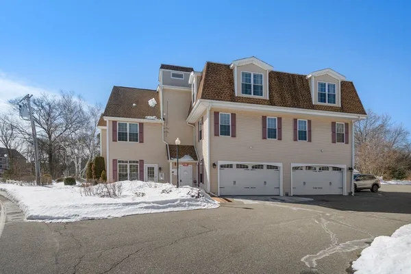a view of a house with a snow in the background