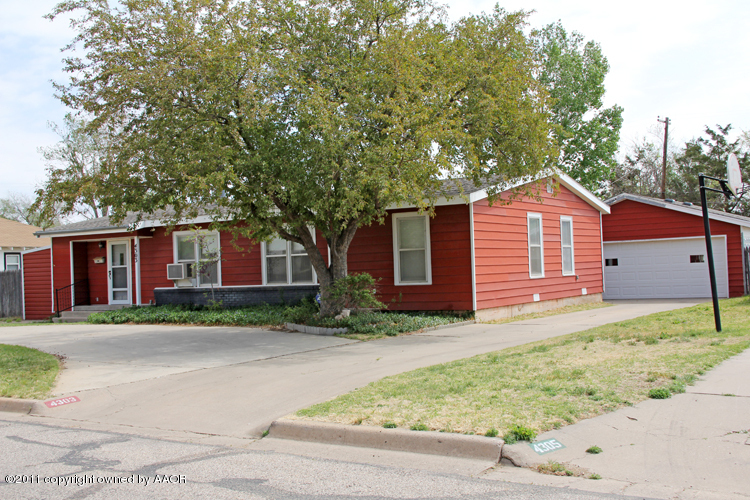4303 South Lipscomb Street Amarillo, TX 79110 - Photo 2 of 35 a front view of a house with garden