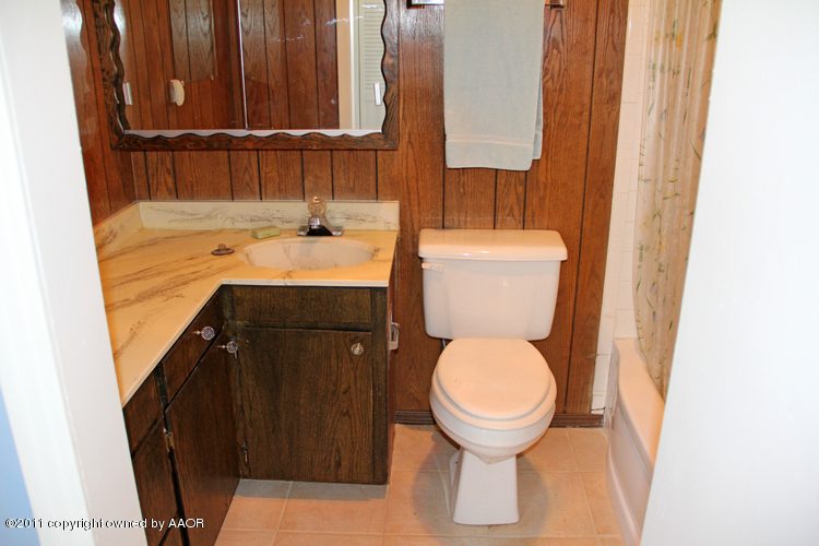 4303 South Lipscomb Street Amarillo, TX 79110 - Photo 19 of 35 a bathroom with a sink and a toilet