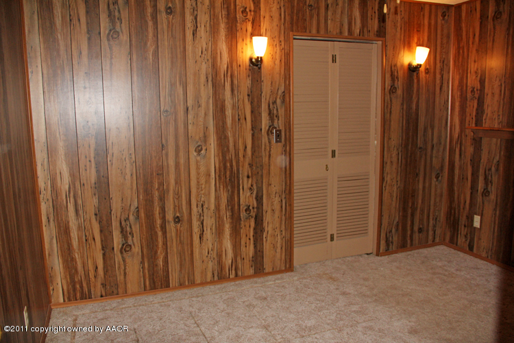 4303 South Lipscomb Street Amarillo, TX 79110 - Photo 23 of 35 a view of a elevator with wooden door