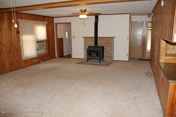 4303 South Lipscomb Street Amarillo, TX 79110 - Photo 6 of 35 a view of an empty room with a fireplace