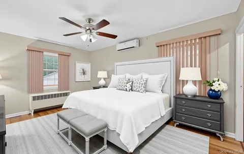 an empty room with windows and closet