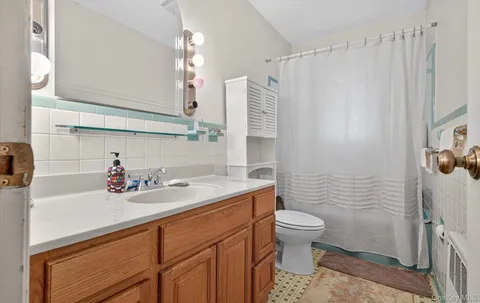 a view of an empty room with stairs