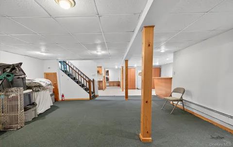 a view of house with backyard