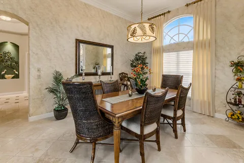 a living room with furniture dining table and wooden floor