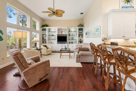 a kitchen with stainless steel appliances granite countertop a stove a sink and white cabinets