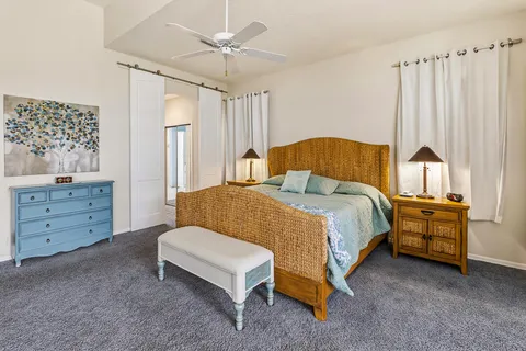 a en suite bathroom with a double vanity sink and a mirror