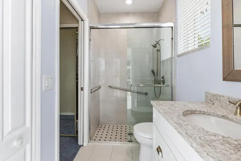 a view of a balcony with table and chairs