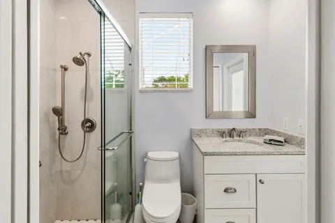 a view of a yard with a house in the background