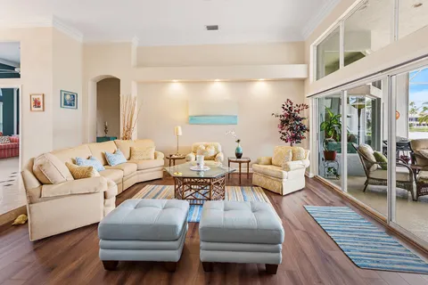 a dining room with furniture a livingroom and chandelier