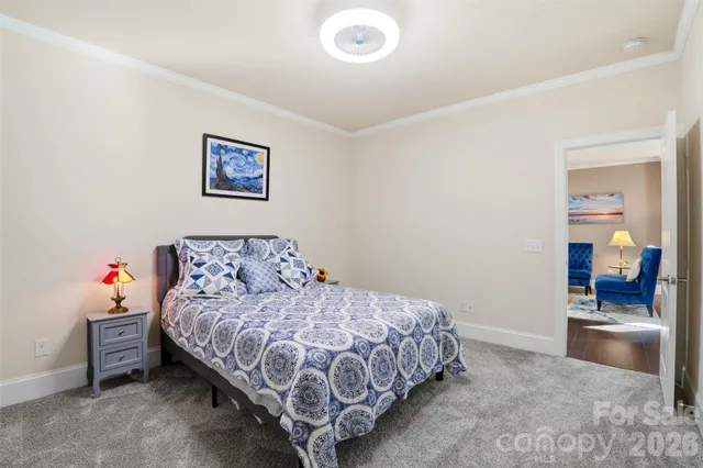 a bedroom with a bed and a view of bathroom