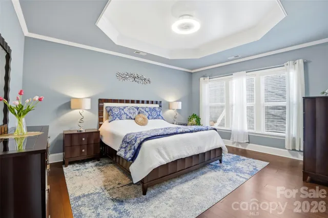 a bedroom with a large bed and a large window