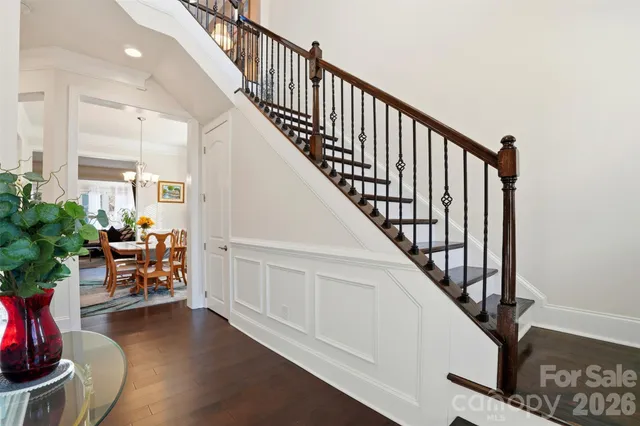 a view of entryway and hall with wooden floor