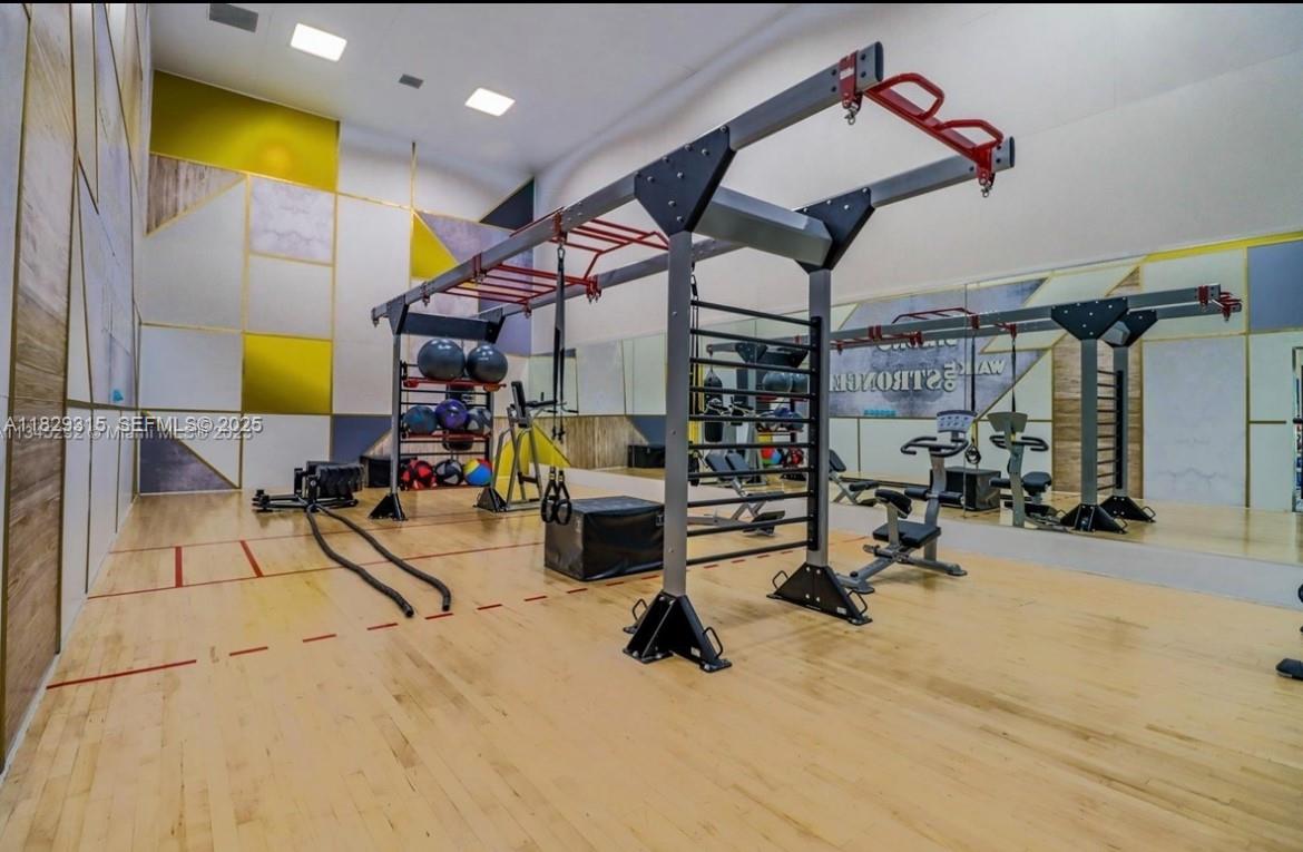 10670 Southwest 156th Place, Unit 309 Miami, FL 33196 - Photo 23 of 31 a view of a room with gym equipment