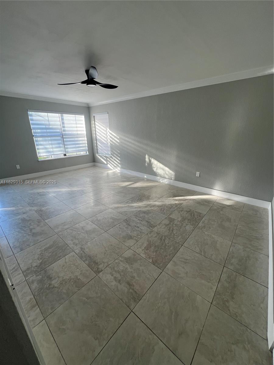 10670 Southwest 156th Place, Unit 309 Miami, FL 33196 - Photo 6 of 31 a view of an empty room with a window