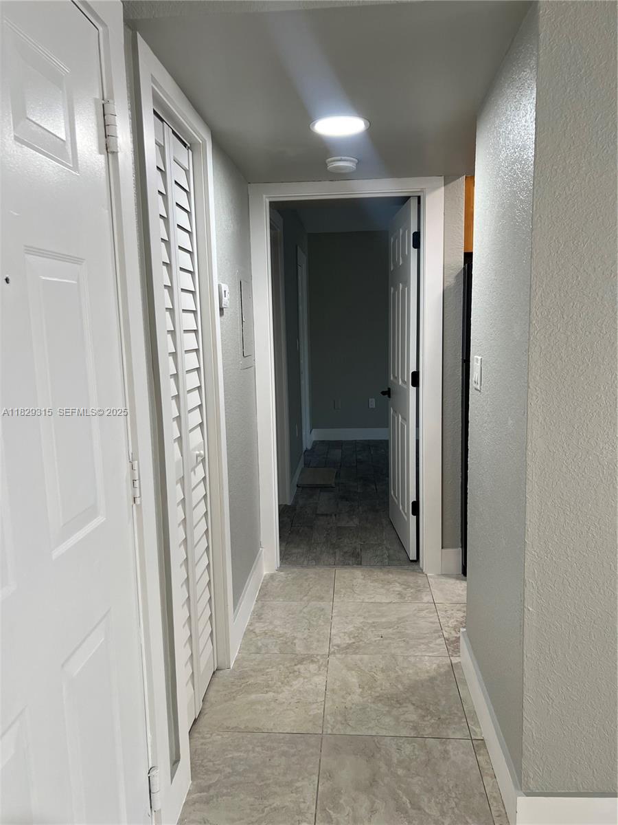 10670 Southwest 156th Place, Unit 309 Miami, FL 33196 - Photo 9 of 31 a view of a hallway
