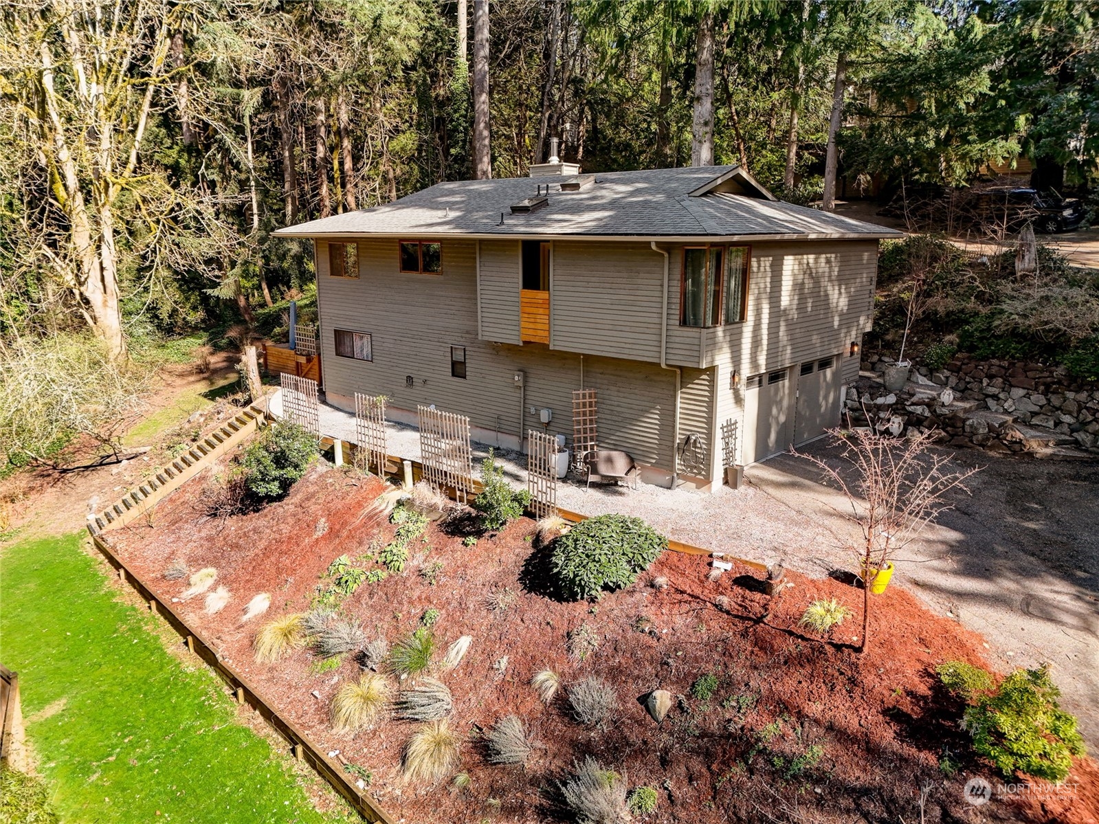8825 Shell Place Edmonds, WA 98026 - Photo 1 of 40 a view of a house with a yard and sitting area