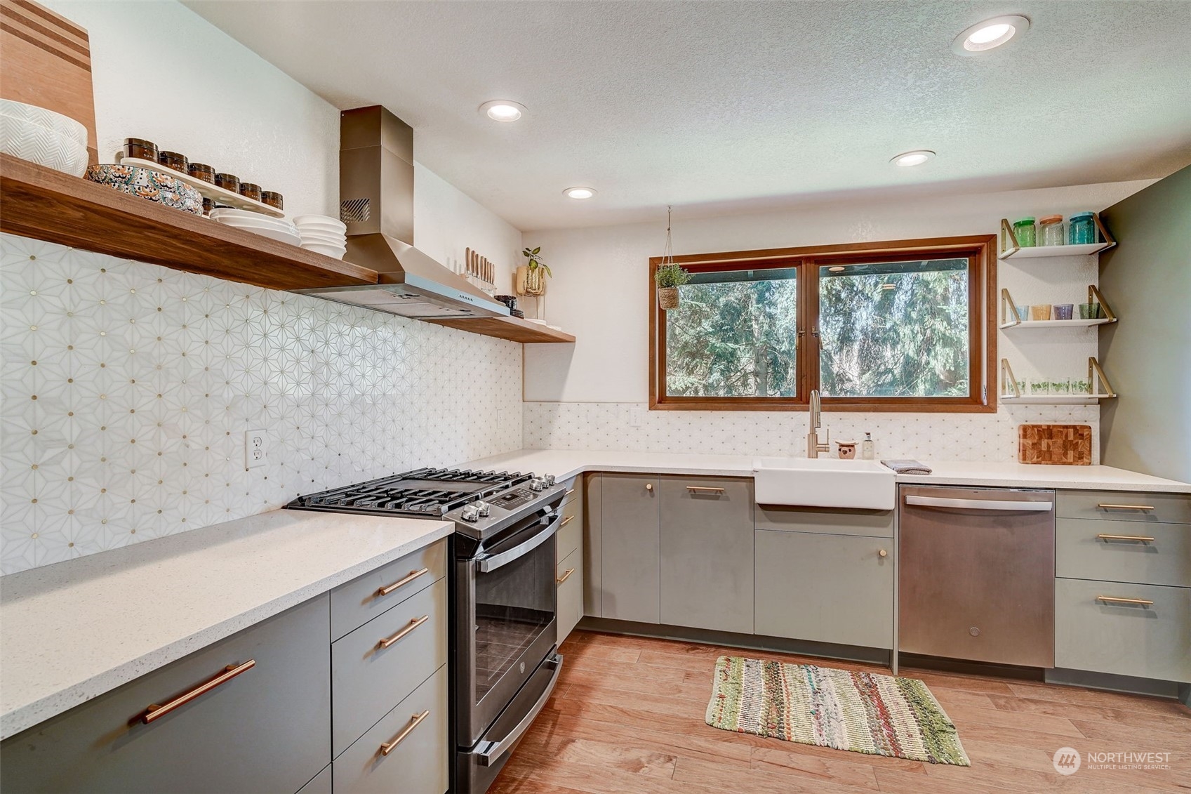8825 Shell Place Edmonds, WA 98026 - Photo 11 of 40 a kitchen that has a sink and a stove