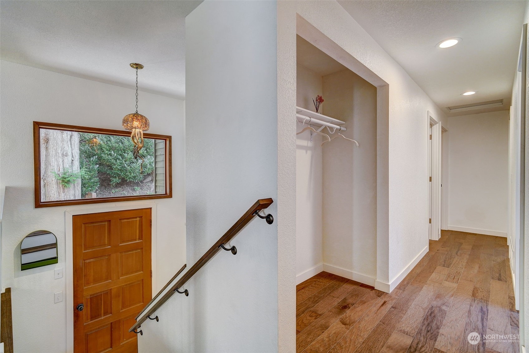 8825 Shell Place Edmonds, WA 98026 - Photo 13 of 40 a view of hallway with stairs and a window