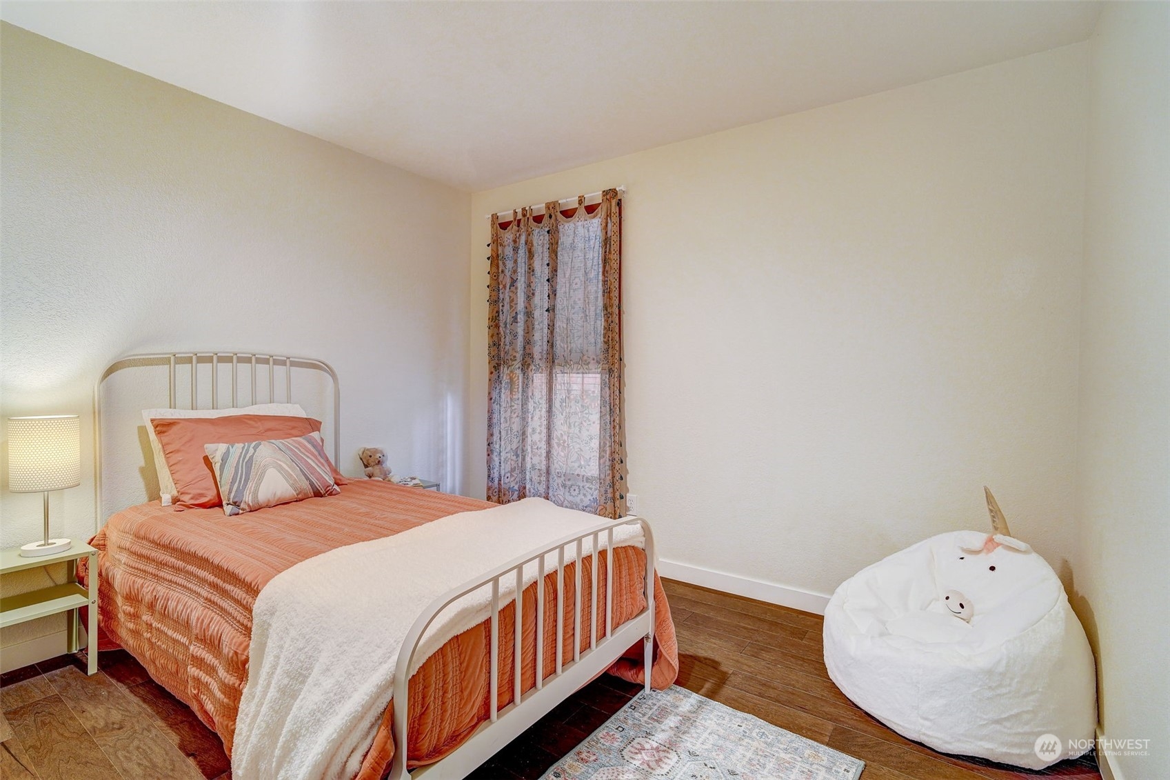 8825 Shell Place Edmonds, WA 98026 - Photo 16 of 40 a bedroom with a bed and a window