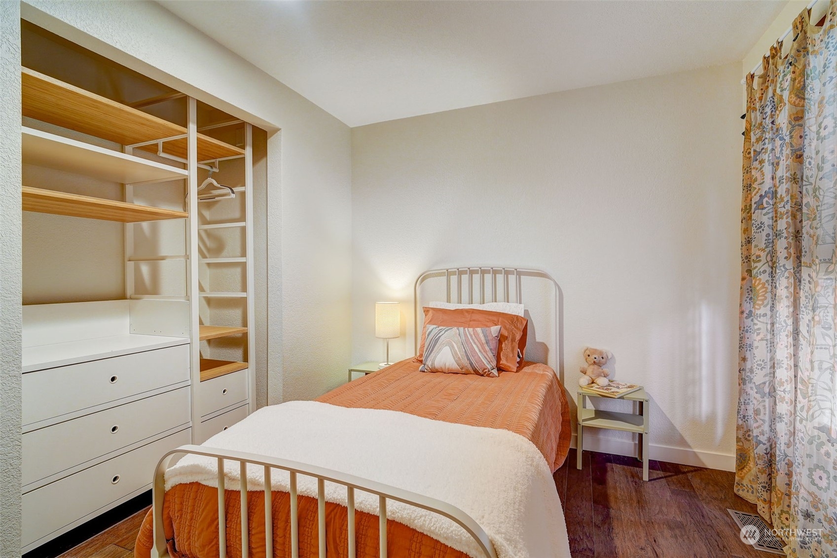 8825 Shell Place Edmonds, WA 98026 - Photo 17 of 40 a bedroom with a bed and a window