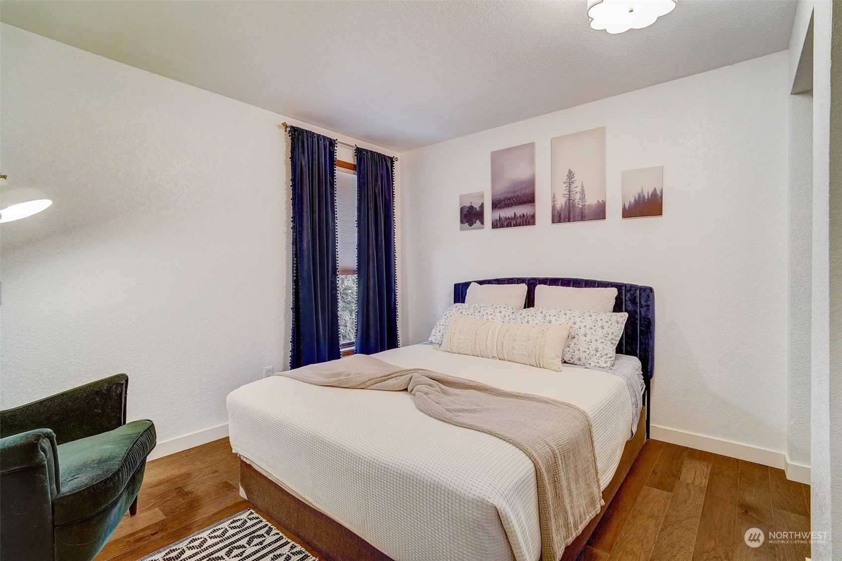 8825 Shell Place Edmonds, WA 98026 - Photo 18 of 40 a bedroom with a bed and a night stand