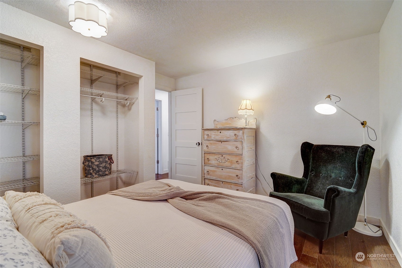 8825 Shell Place Edmonds, WA 98026 - Photo 19 of 40 a bedroom with a bed and furniture