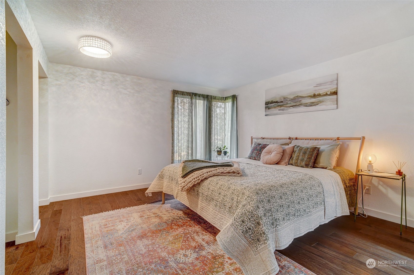 8825 Shell Place Edmonds, WA 98026 - Photo 20 of 40 a bedroom with a bed and a night stand