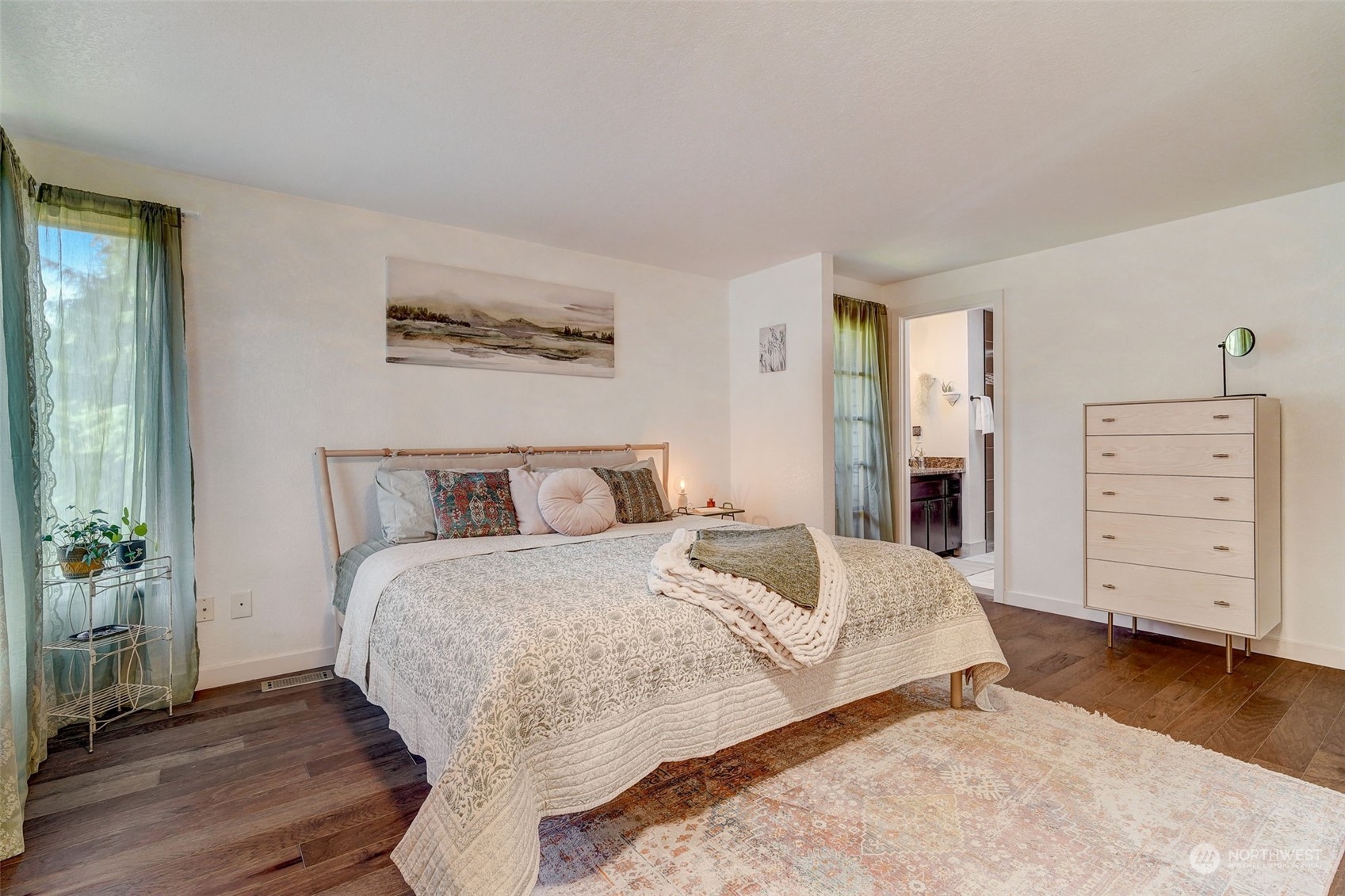 8825 Shell Place Edmonds, WA 98026 - Photo 21 of 40 a bedroom with a bed and a television