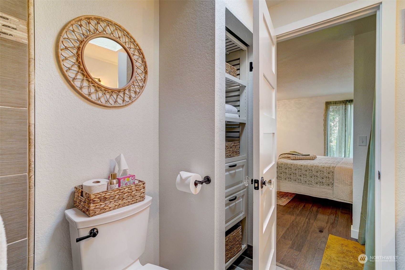 8825 Shell Place Edmonds, WA 98026 - Photo 23 of 40 a bathroom with a toilet and a mirror