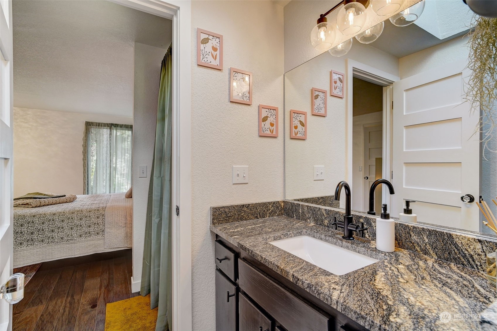 8825 Shell Place Edmonds, WA 98026 - Photo 24 of 40 a bathroom with a granite countertop sink and a mirror