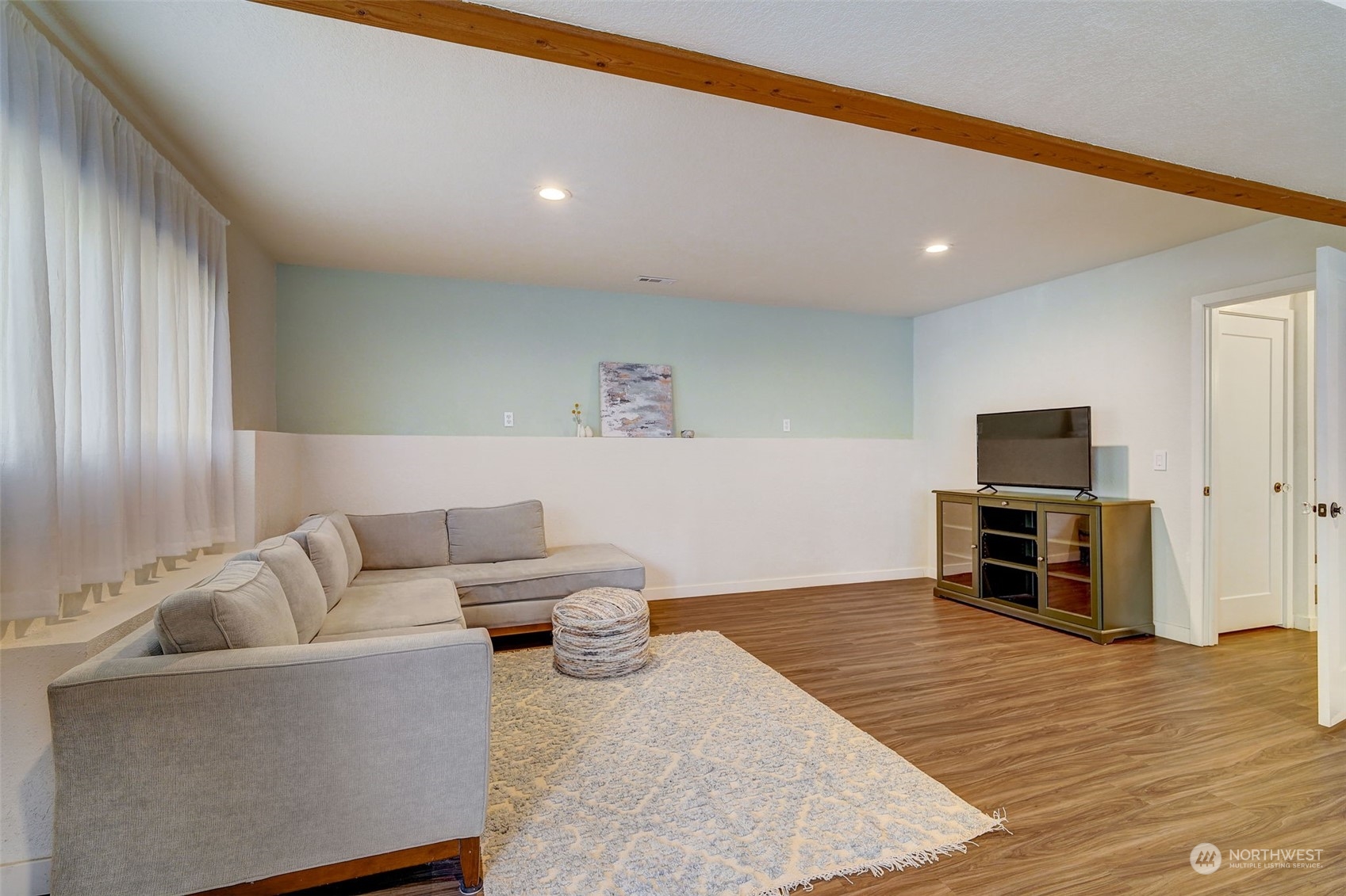 8825 Shell Place Edmonds, WA 98026 - Photo 28 of 40 a living room with furniture and a flat screen tv