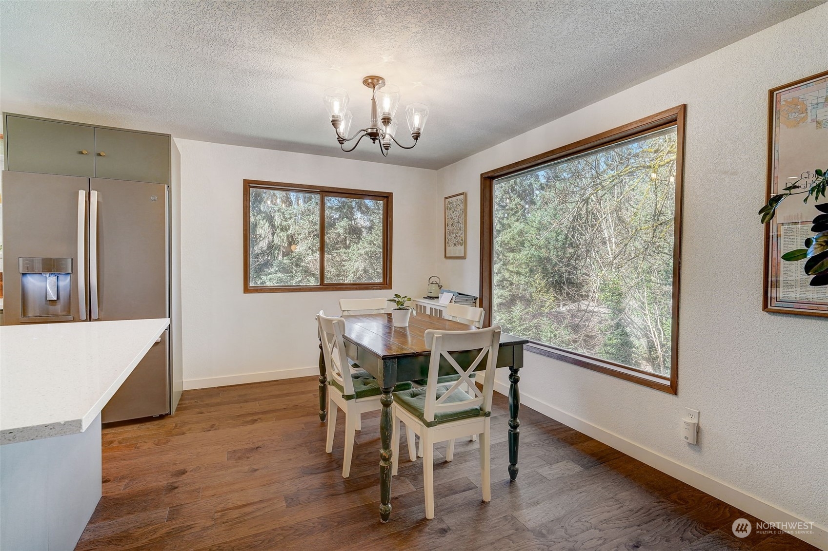 8825 Shell Place Edmonds, WA 98026 - Photo 6 of 40 a view of a dining room with furniture window and wooden floor