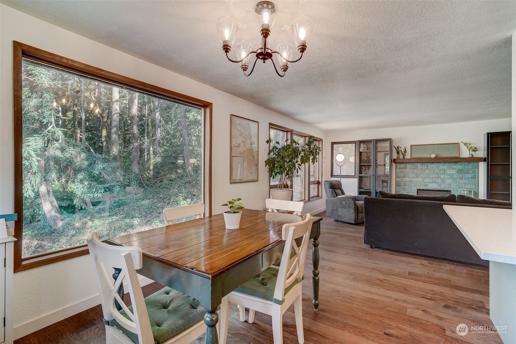 8825 Shell Place Edmonds, WA 98026 - Photo 8 of 40 a view of a dining room with furniture window and wooden floor