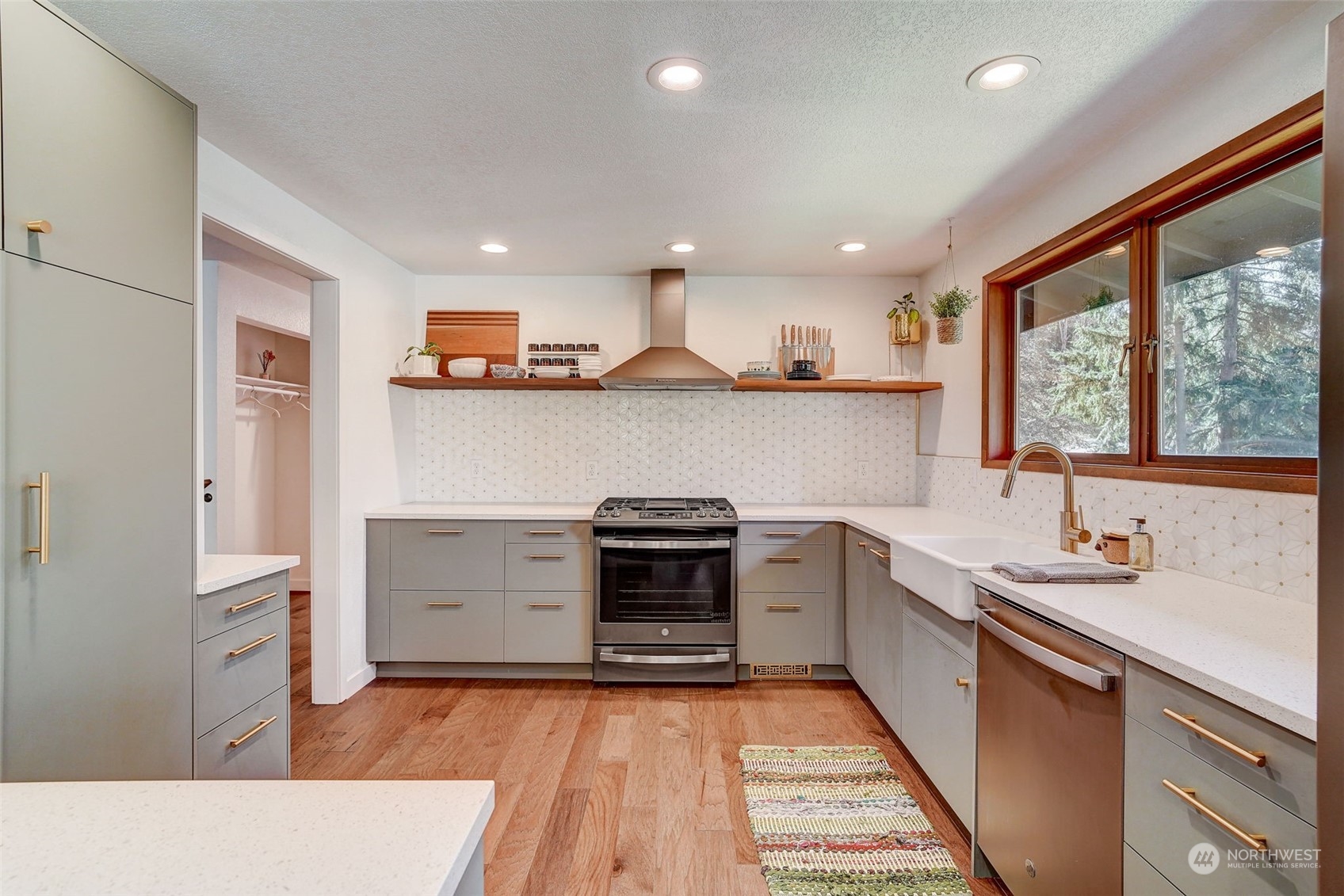 8825 Shell Place Edmonds, WA 98026 - Photo 9 of 40 a kitchen with a sink stove and cabinets