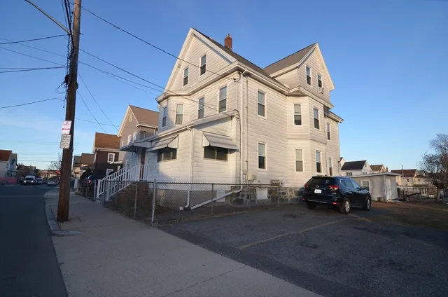 a car parked in front of a house