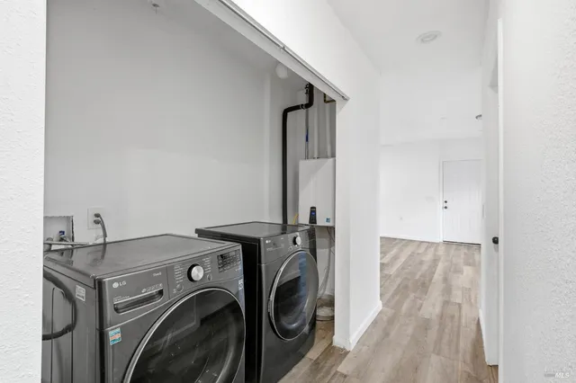 a utility room with dryer and washer