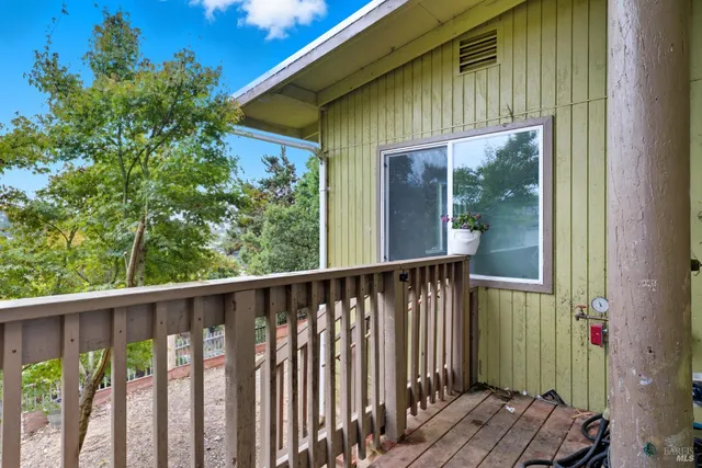 a view of a house with porch and wooden floor