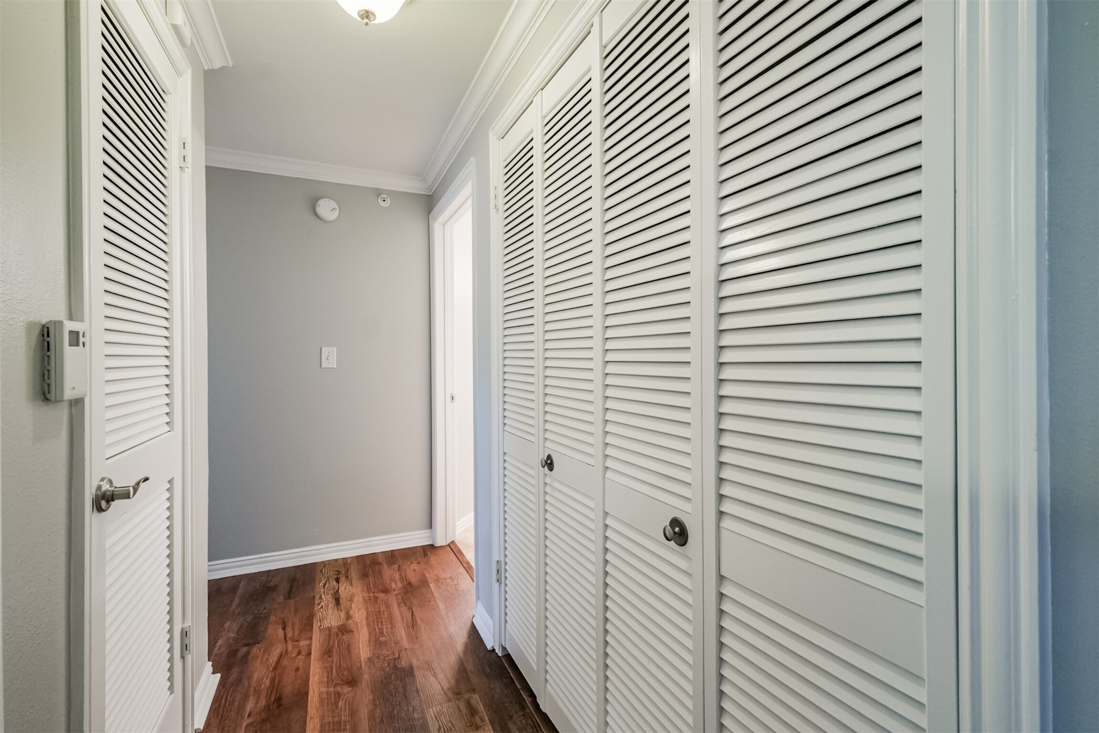 2111 Welch Street, Unit B304 Houston, TX 77019 - Photo 16 of 37 a view of a hallway with wooden floor