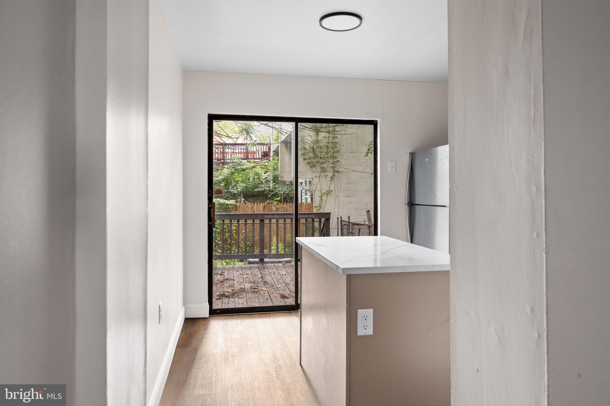 322 South Poppleton Street Baltimore, MD 21230 - Photo 8 of 34 Bright kitchen with garden view.