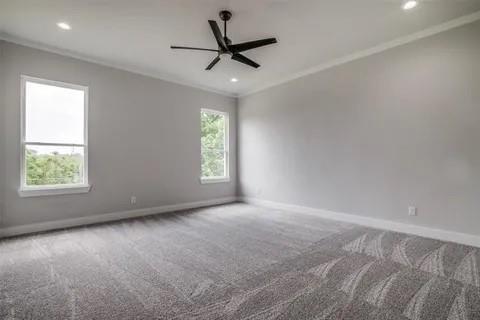 1702 Seevers Avenue Dallas, TX 75216 - Photo 16 of 24 an empty room with a window and a ceiling fan