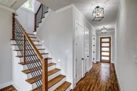 1702 Seevers Avenue Dallas, TX 75216 - Photo 2 of 24 a view of a hallway with wooden floor and staircase