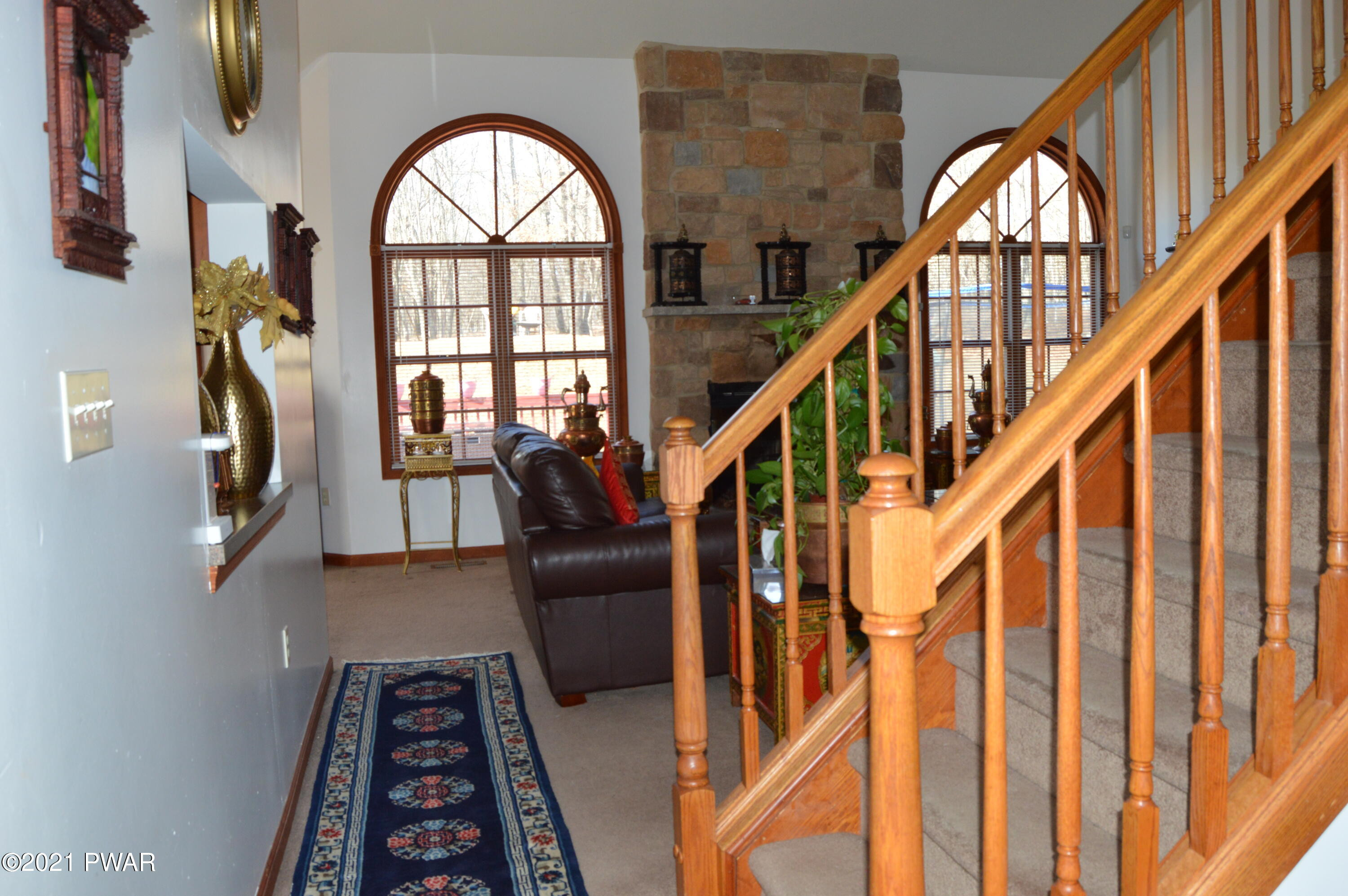 4281 Pne Rdg Drive Bushkill, PA 18324 - Photo 10 of 30 a view of entryway with wooden floor and a front door