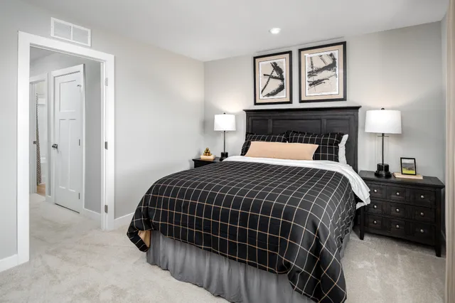 a bedroom with a bed and walk in closet