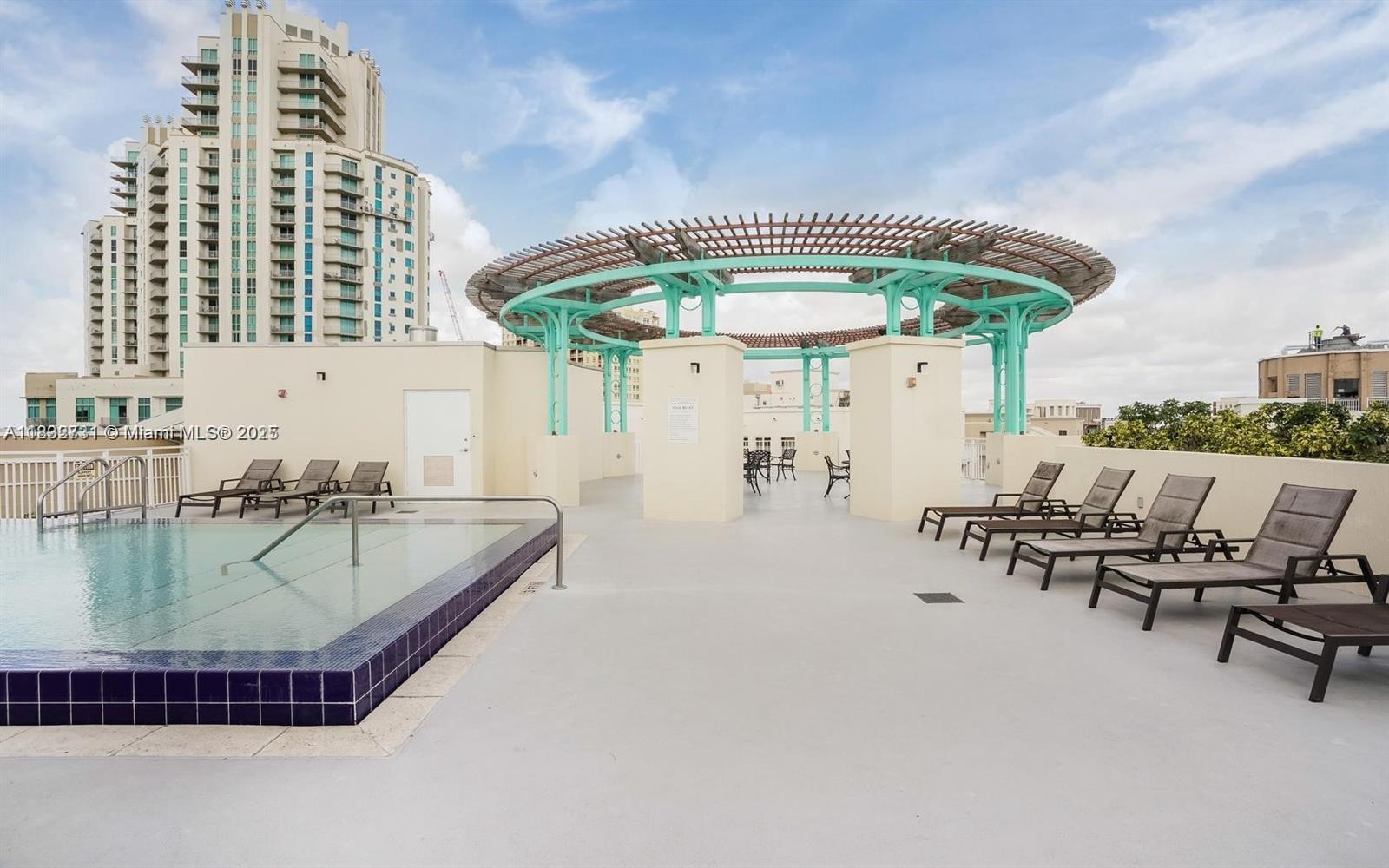 7270 Southwest 88th Street, Unit B502 Miami, FL 33156 - Photo 17 of 20 an outdoor space with swimming pool and furniture