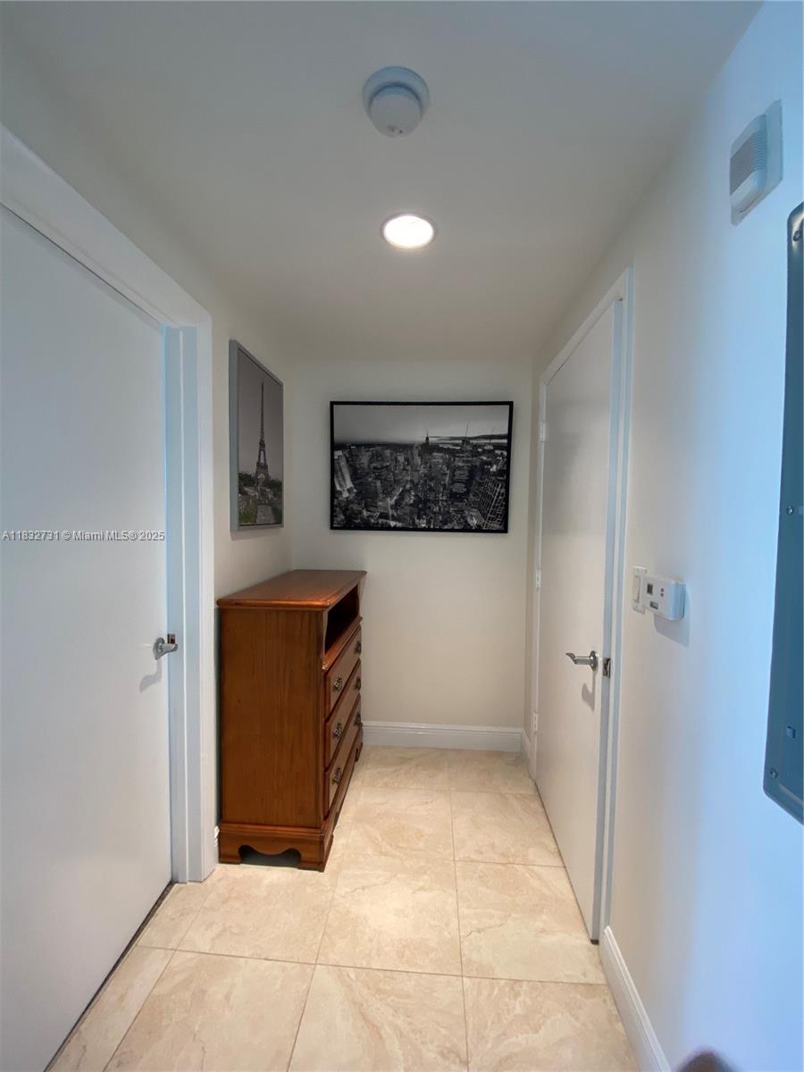 7270 Southwest 88th Street, Unit B502 Miami, FL 33156 - Photo 7 of 20 a view of a hallway